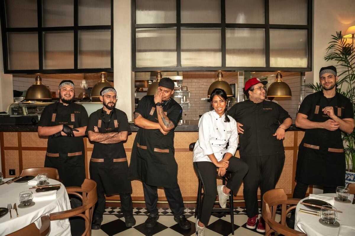 The kitchen team at The Lucky Llama lined up in the restaurant
