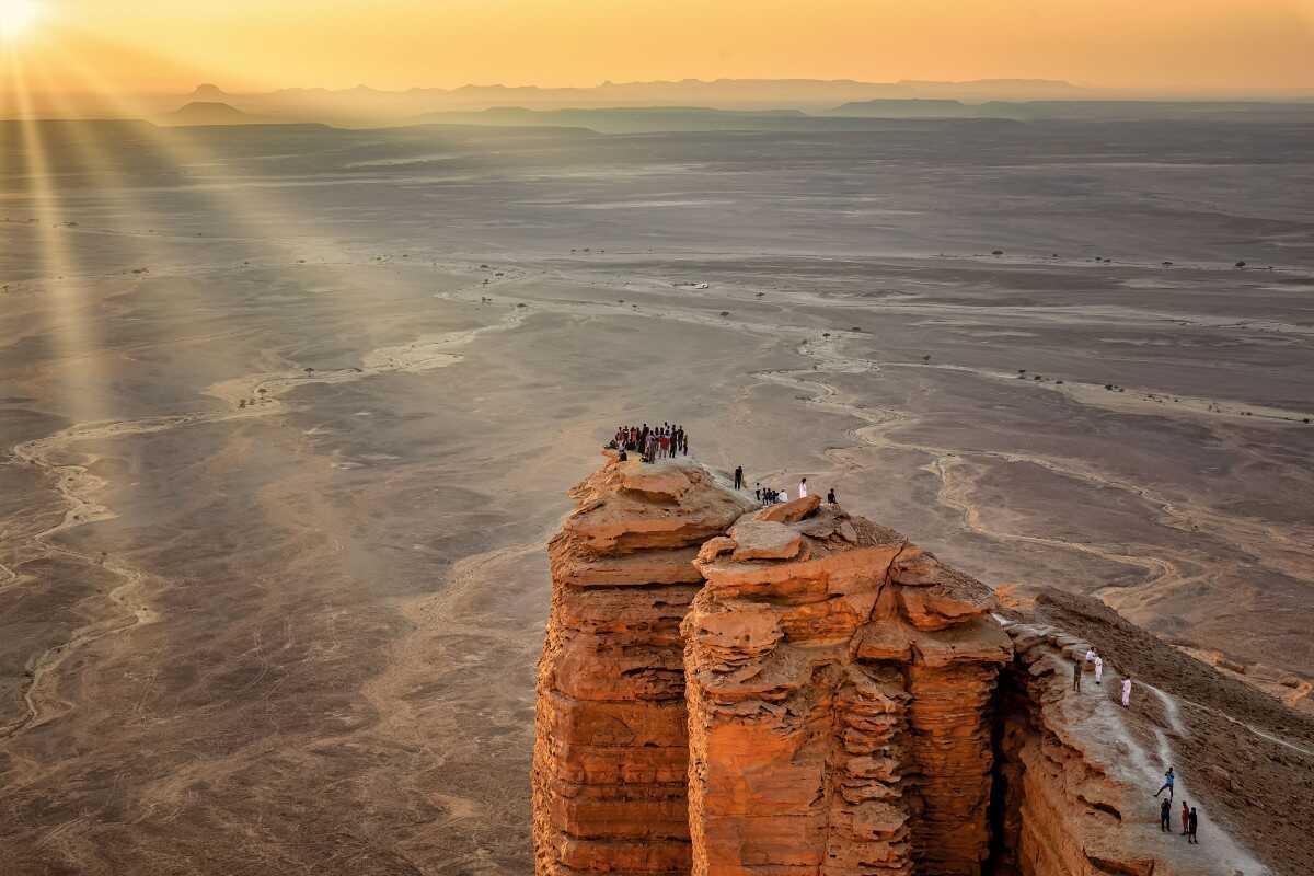 people watching a sunset at the Edge of the World